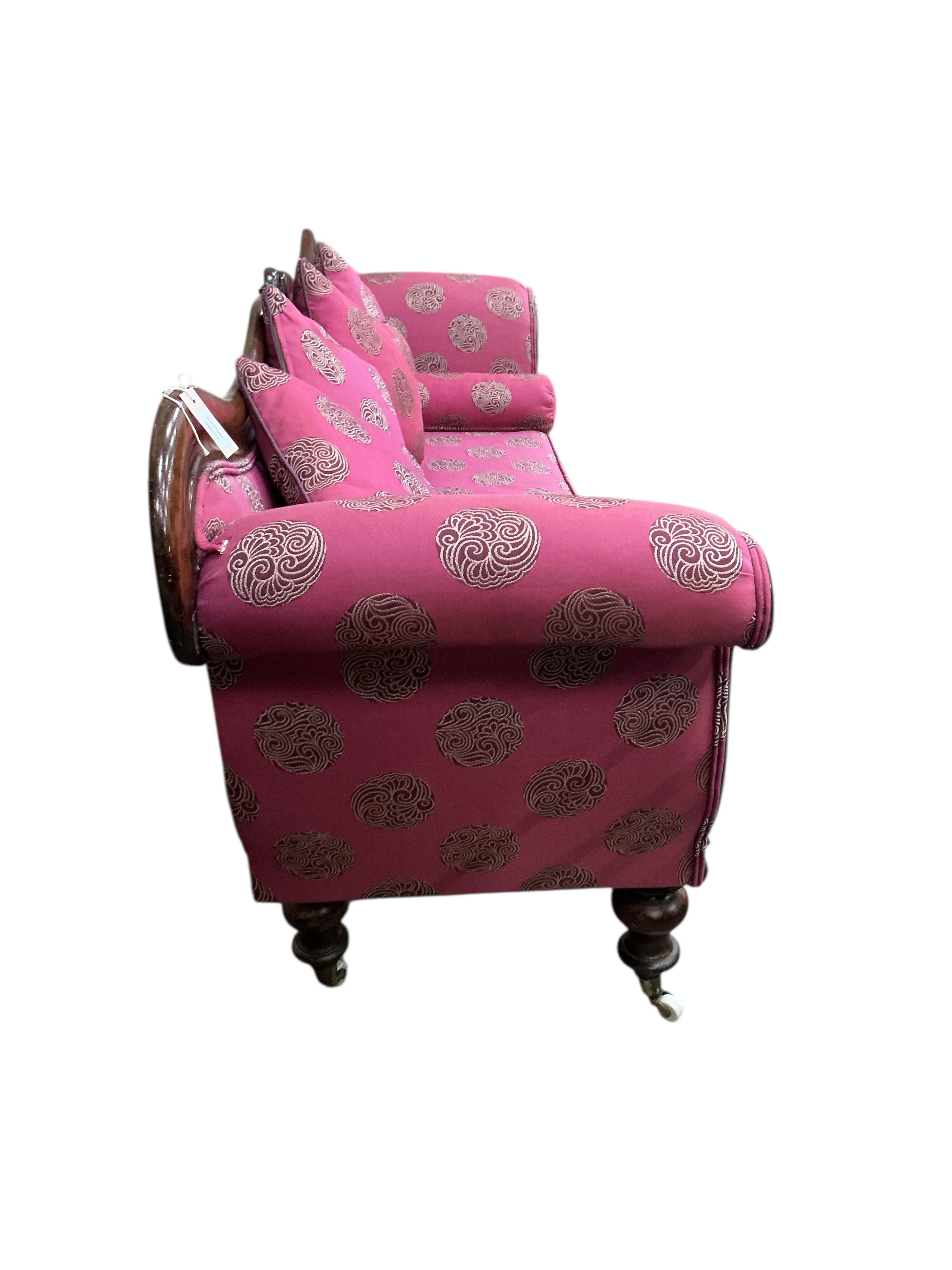 A Victorian mahogany scroll arm settee, width 200cm, depth 55cm, height 86cm